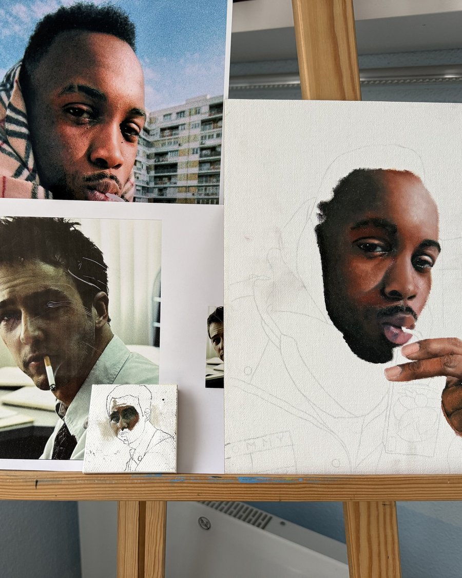 Reference photos alongside a portrait in progress